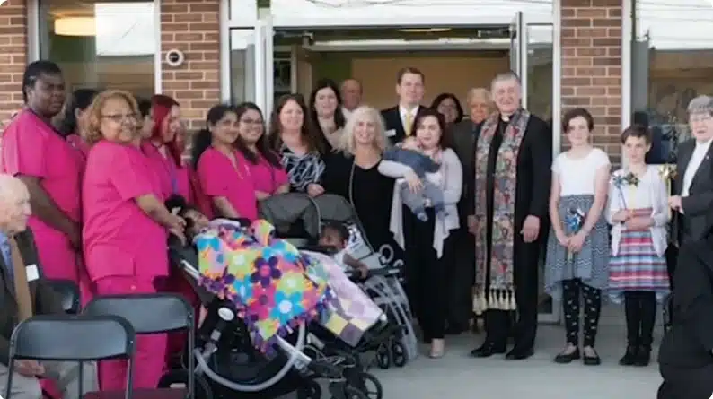 Cardinal Blase Cupich with, Sister Catherine Ryan, staff and patient of Maryville Center for Children
