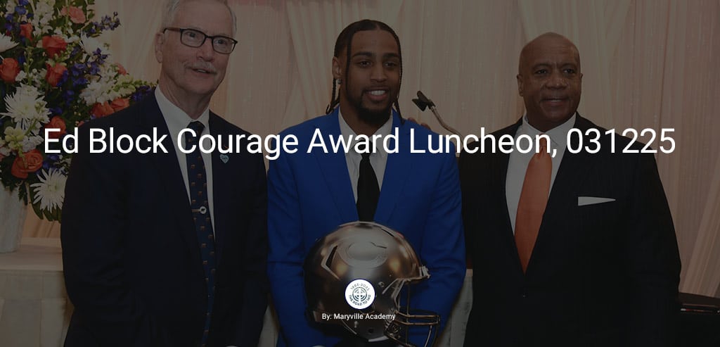 Recipient holding Ed Block Courage Award